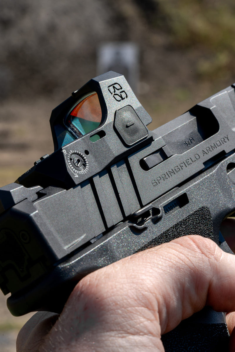 Close-up of MERCURY Reflex Sight side controls and body detail